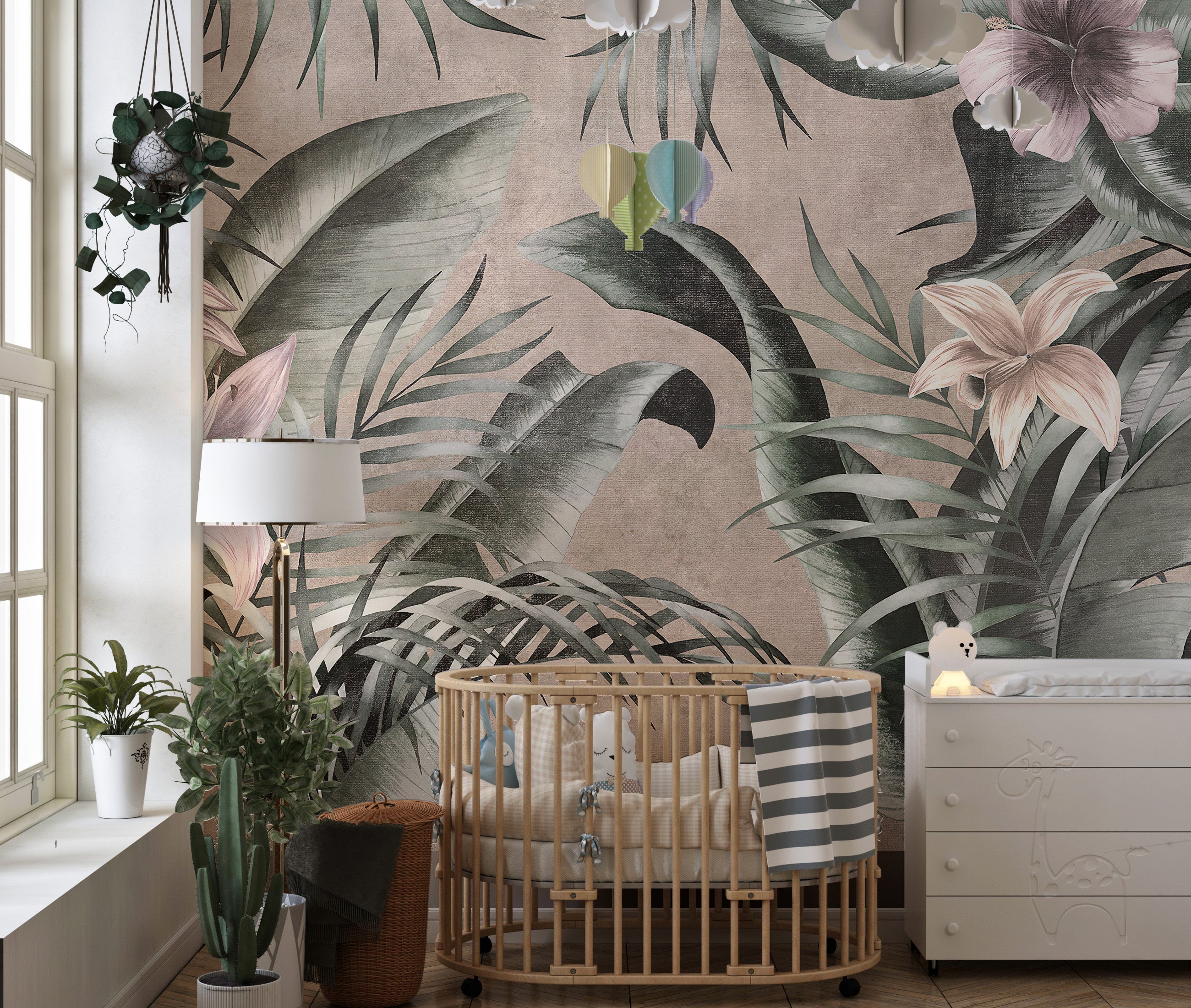 Large green leaves wallpaper mural on a neutral gray backdrop.
