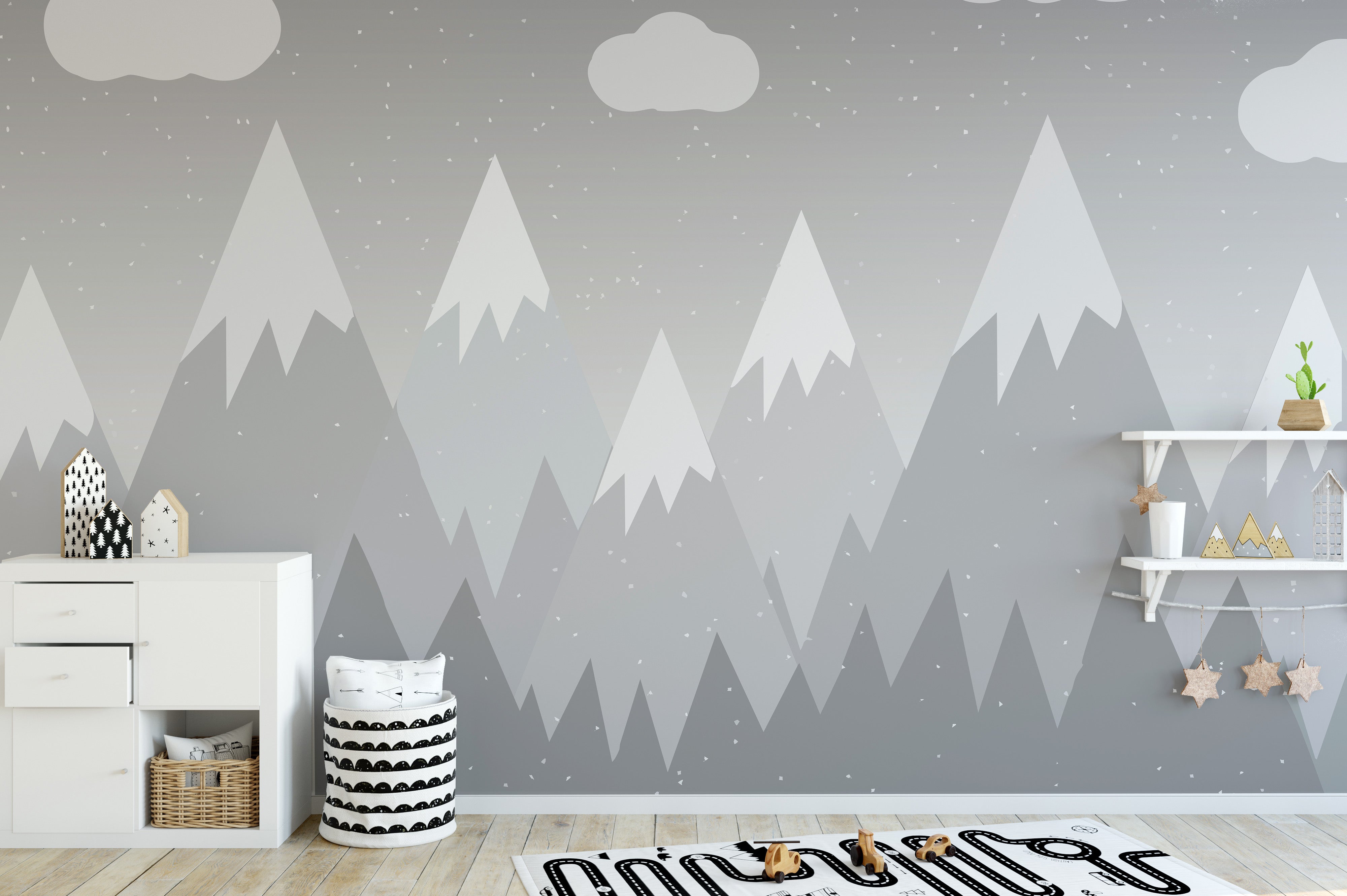 Playful kids' mural featuring grey mountains and soft tones.
