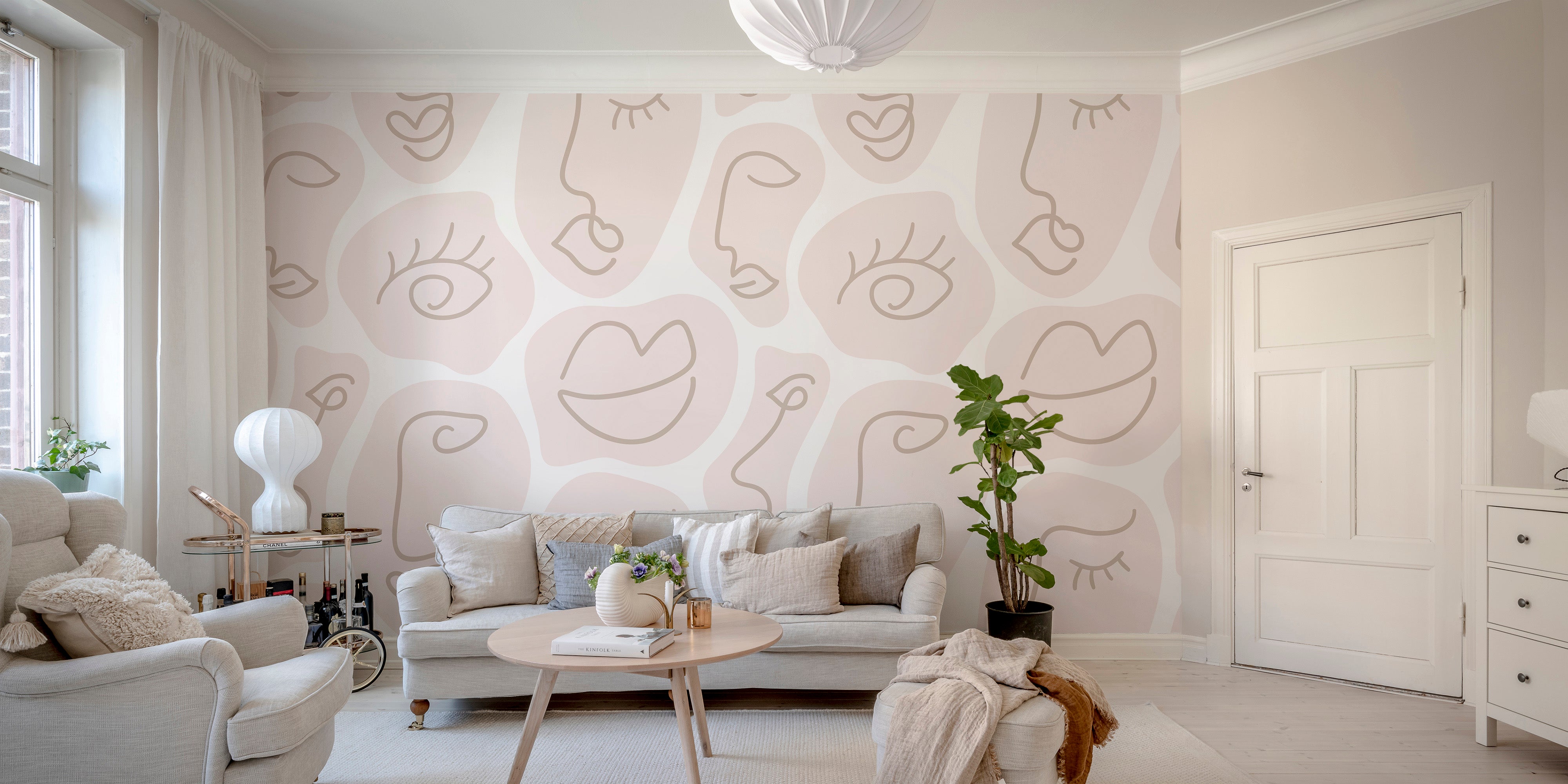 Minimalist wallpaper mural featuring a human face line drawing.
