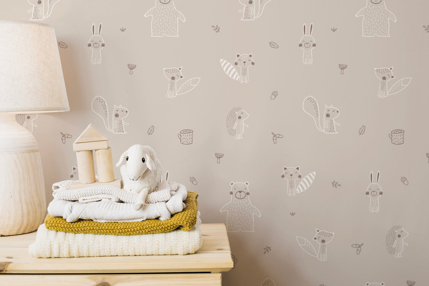 Soft beige forest friends mural for a calming ambiance.
