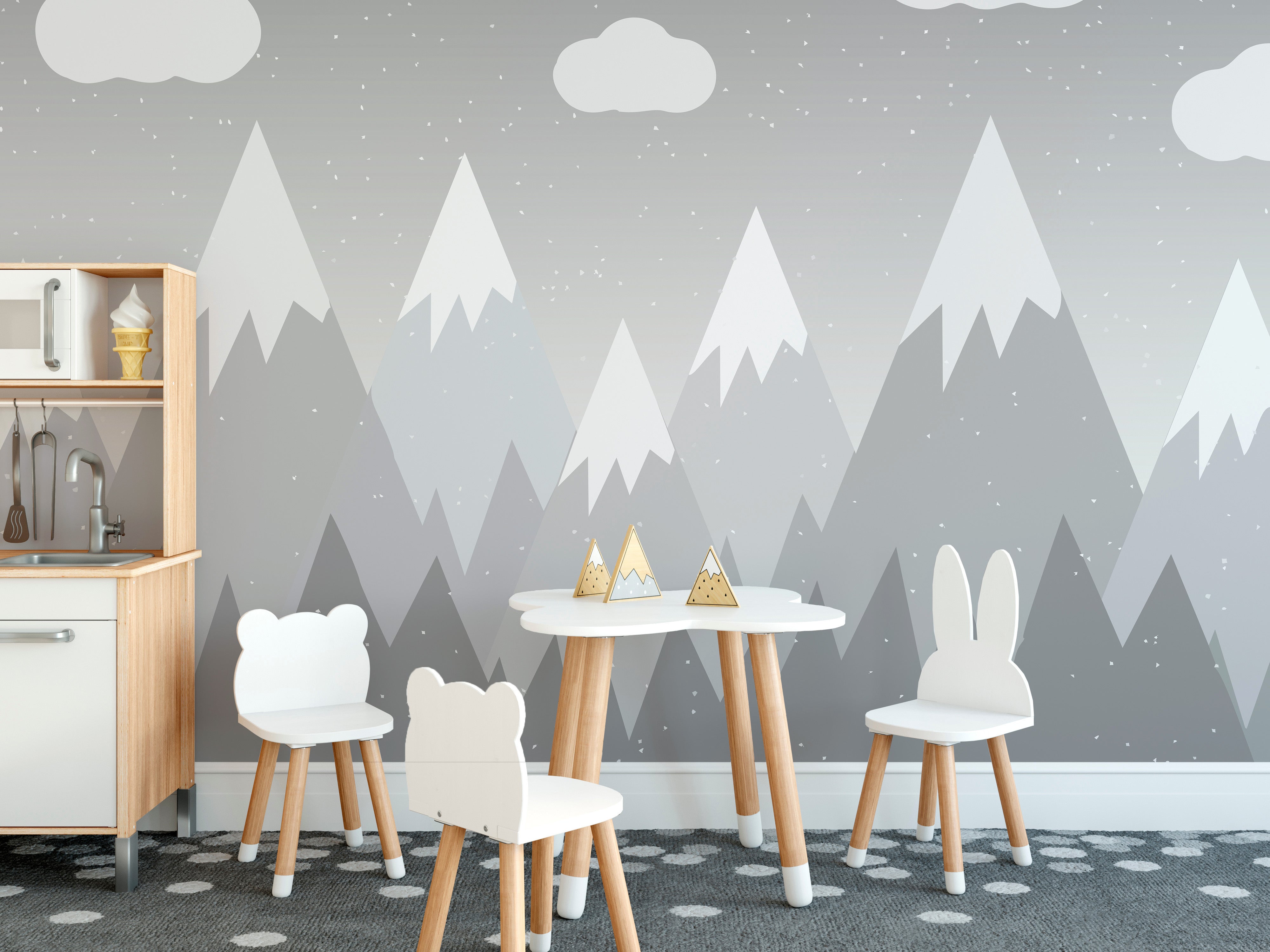 Minimalist kids' mural with gentle grey mountain designs.
