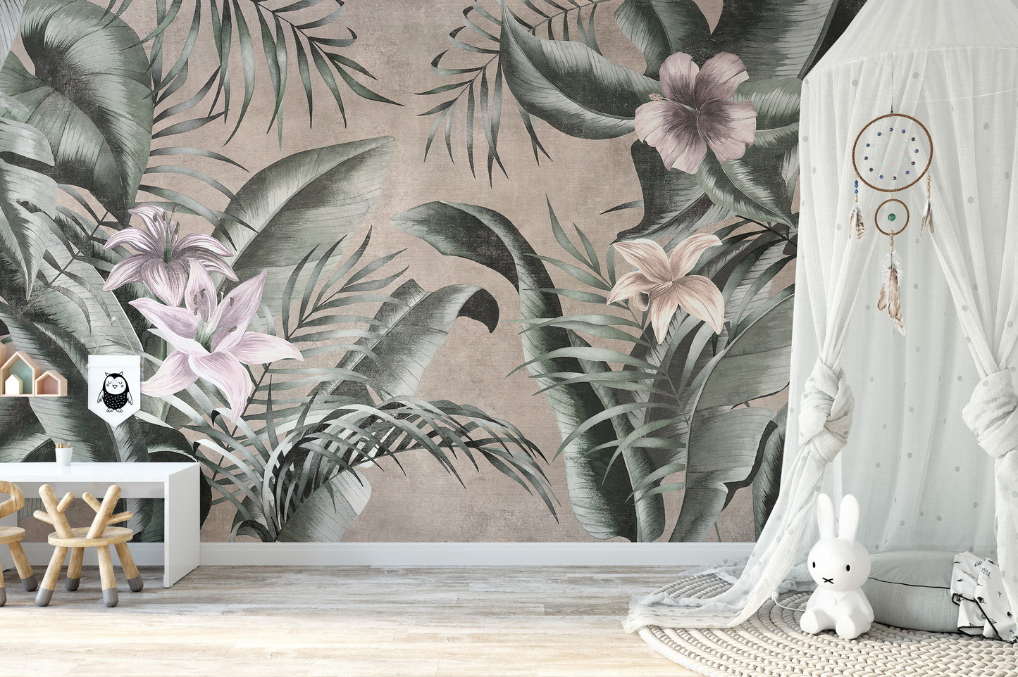 Gray background mural with large green floral leaves design.
