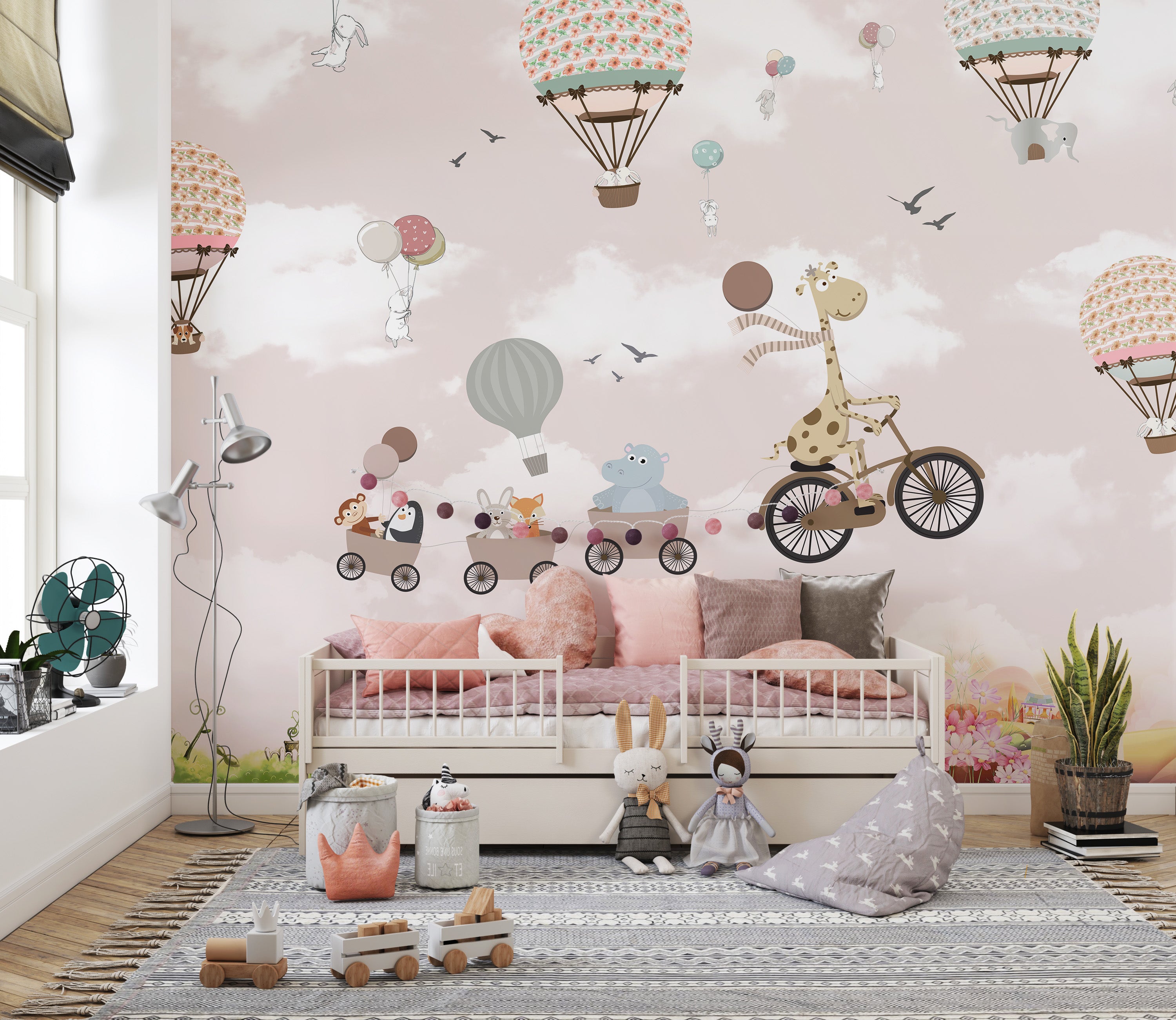 Dreamy pink sky mural featuring safari animals in balloons.
