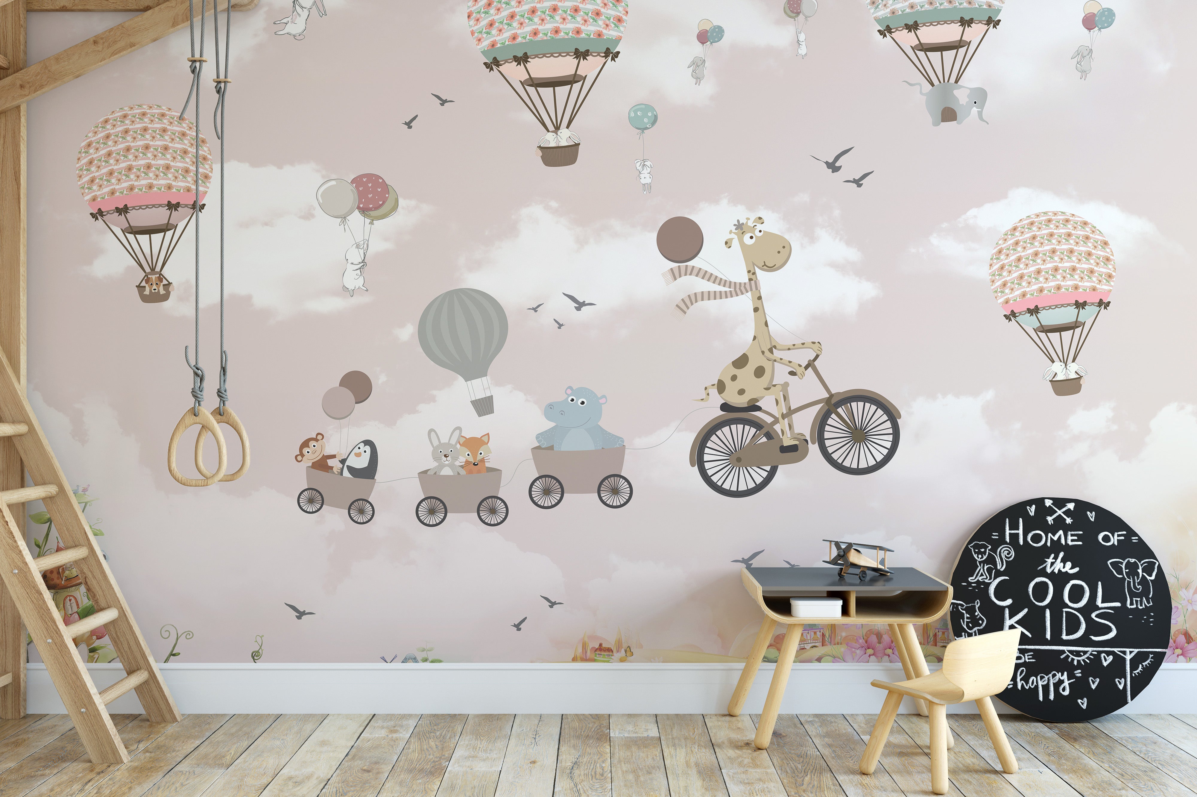 Pink sky wallpaper mural with safari animals in hot air balloons.
