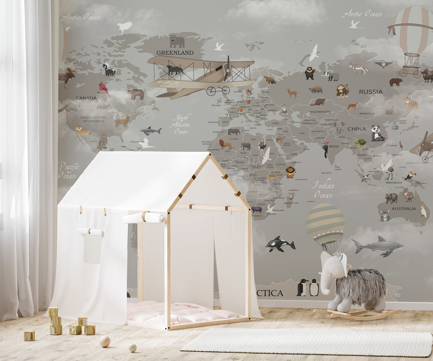 Gray kids’ mural showcasing global wildlife