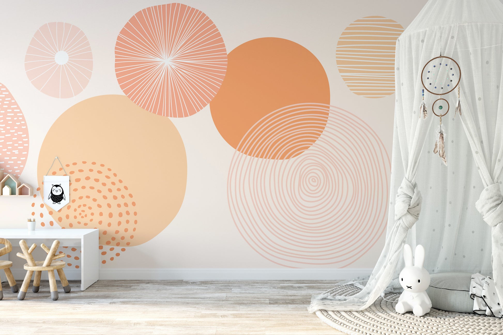 Soft peach abstract wallpaper featuring overlapping circular patterns.