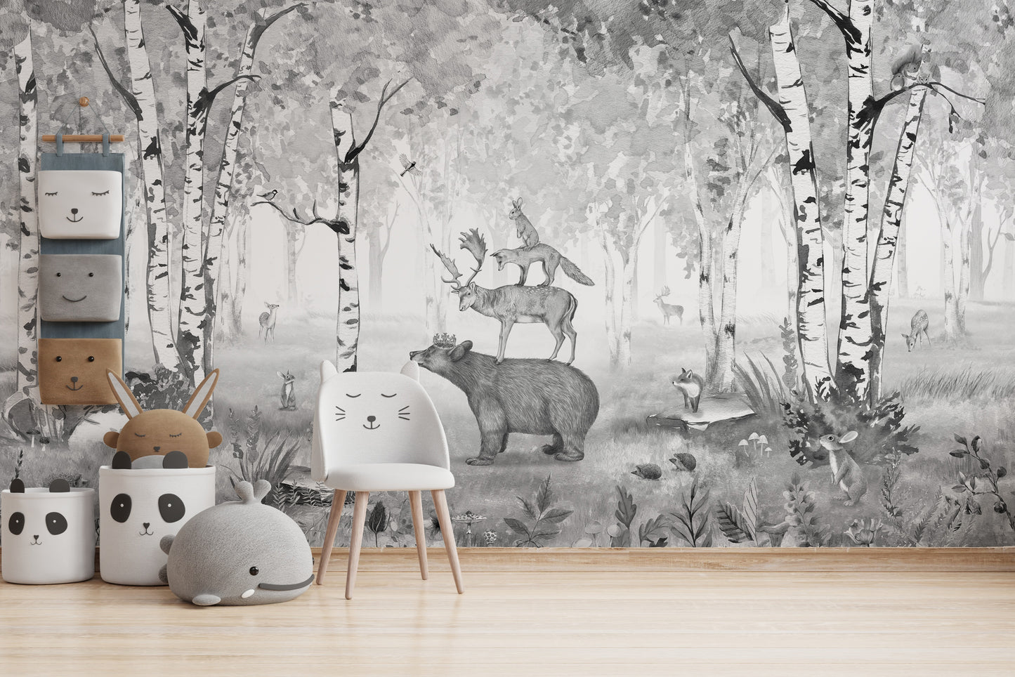 Monochrome forest mural with a bear and woodland animals